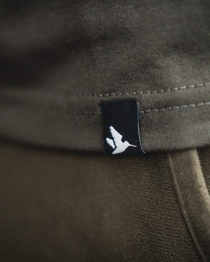 Pine Green Coloured Seeland Thermal T-Shirt on indoor background #colour_pine-green