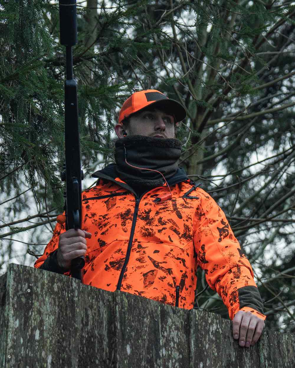 Orange Blaze InVis MPC coloured Seeland Trax Blaze Jacket on forest background #colour_orange-blaze-invis-mpc