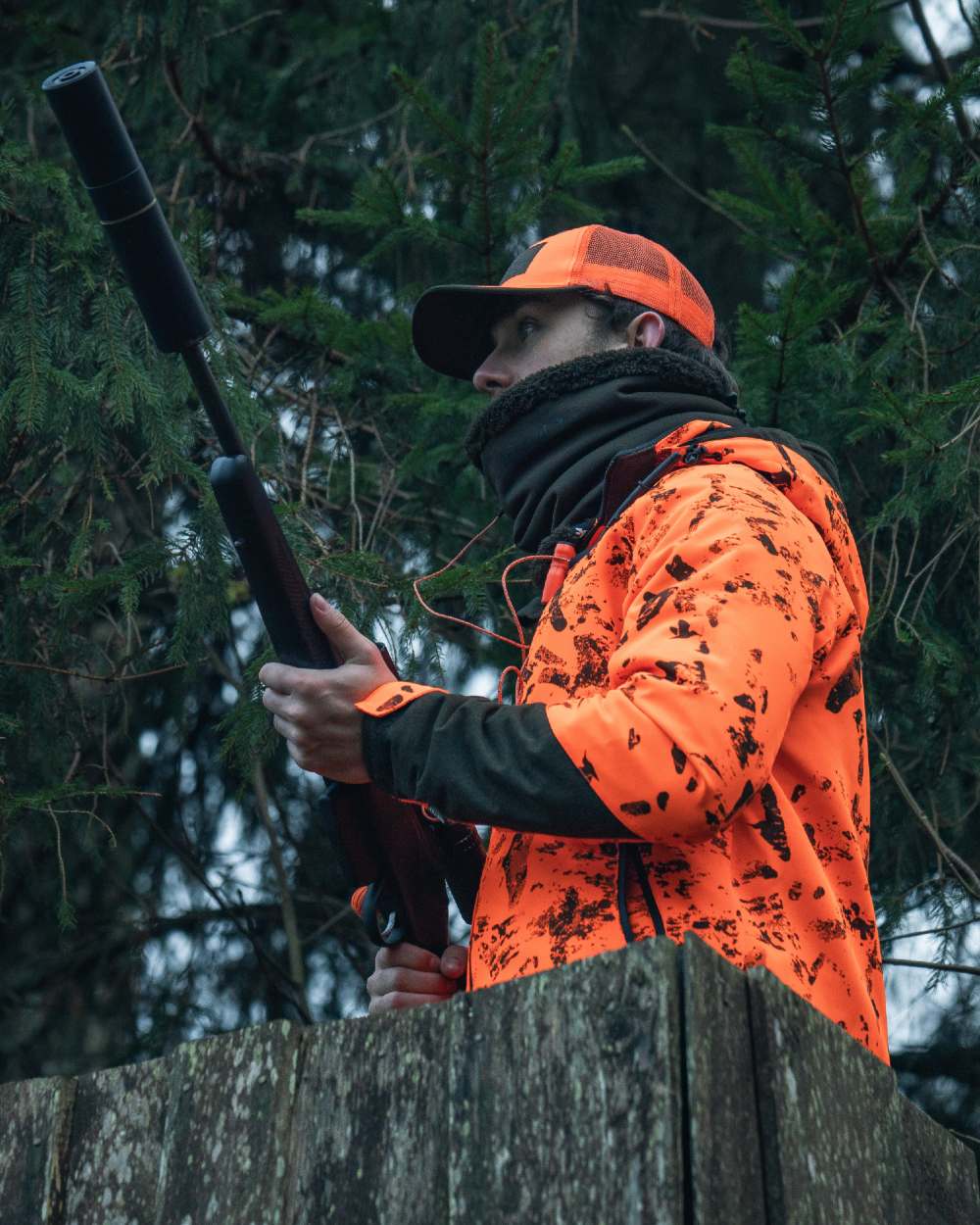 Orange Blaze InVis MPC coloured Seeland Trax Blaze Jacket on forest background #colour_orange-blaze-invis-mpc