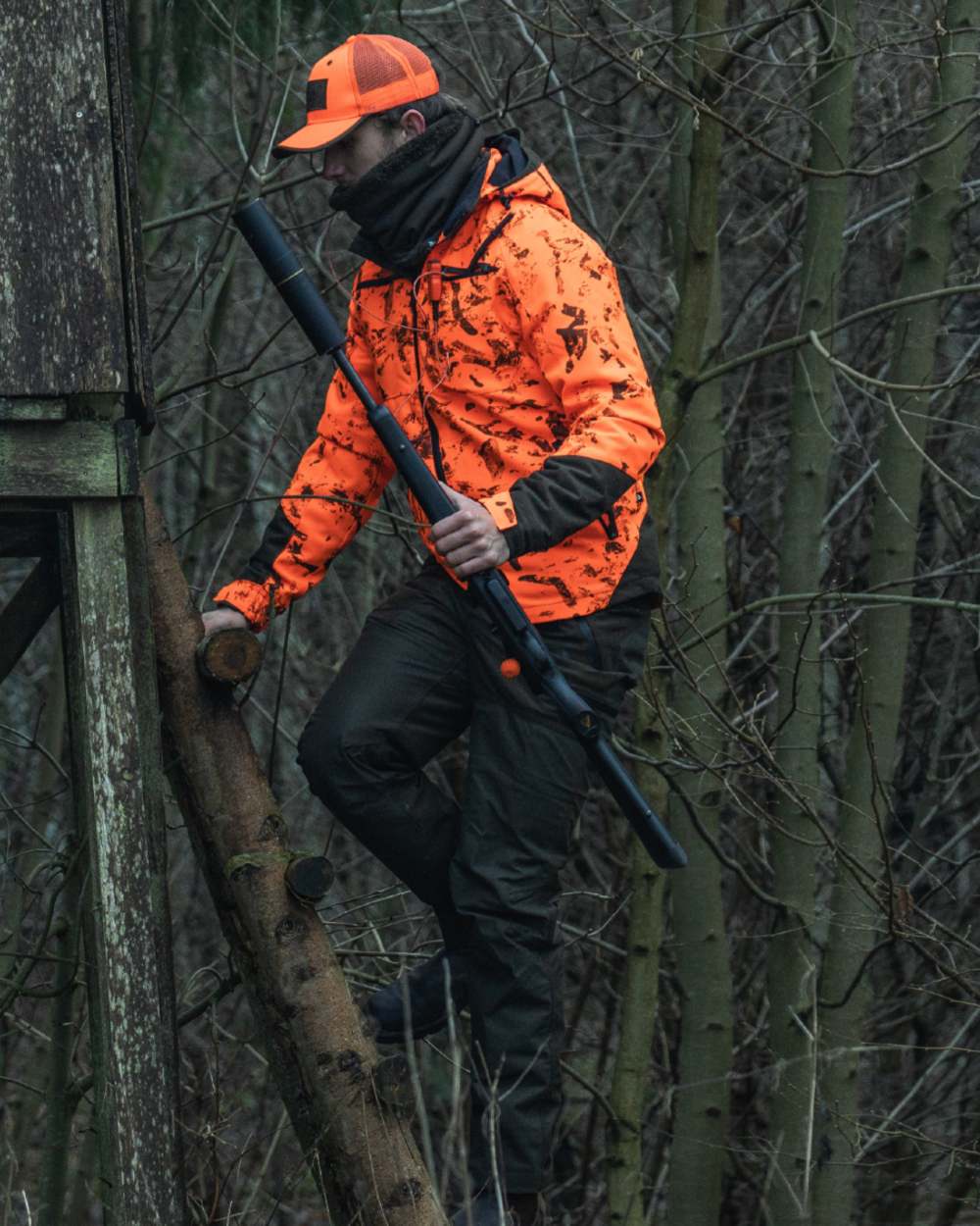 Orange Blaze InVis MPC coloured Seeland Trax Blaze Jacket on forest background #colour_orange-blaze-invis-mpc