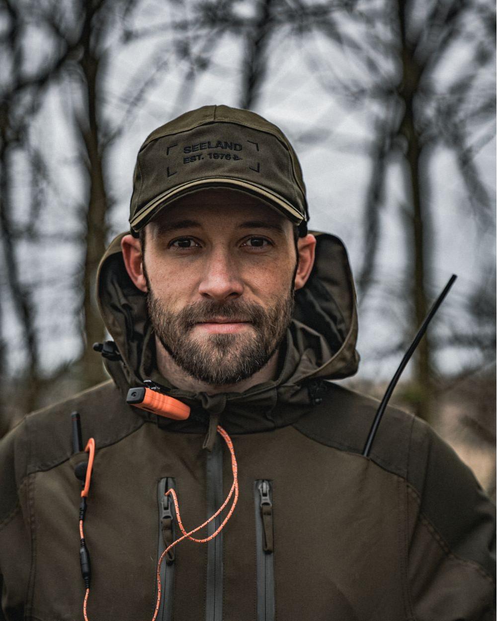 Light Pine Coloured Seeland Trax Cap on forest background #colour_light-pine