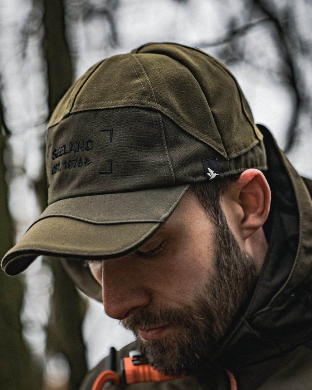Light Pine Coloured Seeland Trax Cap on forest background #colour_light-pine