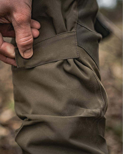 Light Pine Coloured Seeland Trax Trousers on outdoor background #colour_light-pine