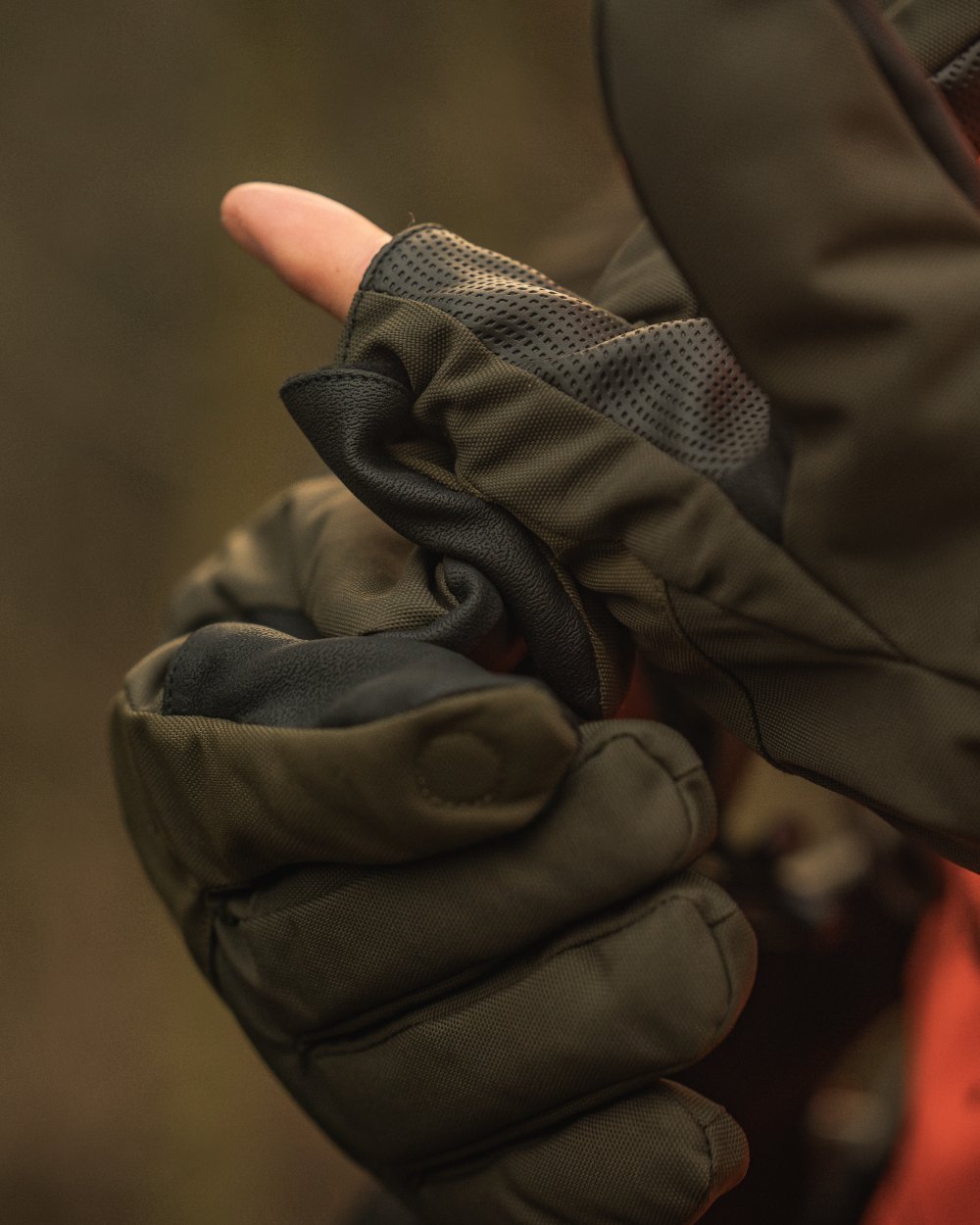 Pine Green coloured Seeland Trigger Fold-Back Gloves on forest background #colour_pine-green