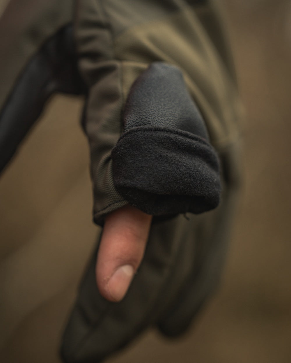 Pine Green coloured Seeland Trigger Fold-Back Gloves on forest background #colour_pine-green