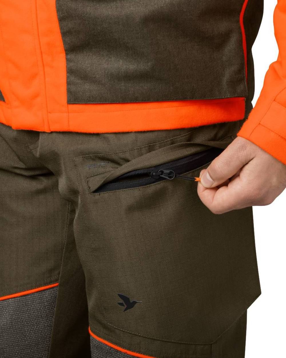 Pine Green Hi-Vis Orange Coloured Seeland Venture Trousers on white background #colour_pine-green-hi-vis-orange