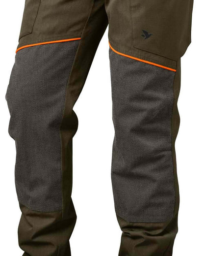 Pine Green Hi-Vis Orange Coloured Seeland Venture Trousers on white background #colour_pine-green-hi-vis-orange