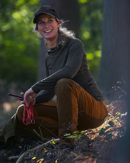 Pine Green Coloured Seeland Womens Active Long Sleeve T-Shirt on forest background #colour_pine-green