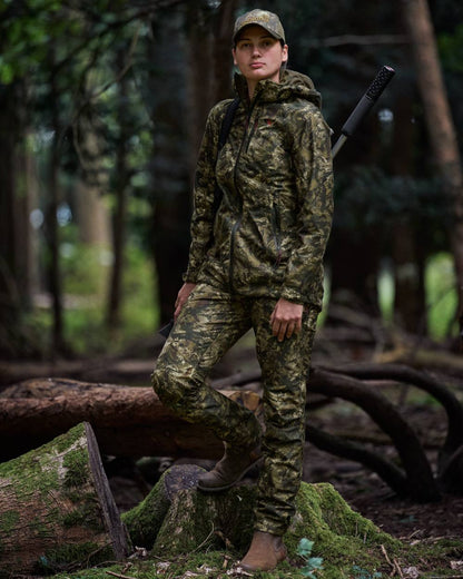 InVis MPC Green Coloured Seeland Womens Avail Camo Trousers on forest background #colour_invis-mpc-green