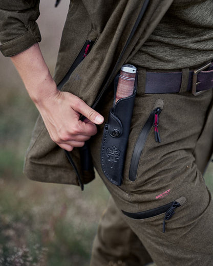 Pine Green Melange Coloured Seeland Womens Avail Trousers on forest background #colour_pine-green-melange