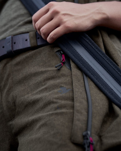 Pine Green Melange Coloured Seeland Womens Avail Trousers on forest background #colour_pine-green-melange