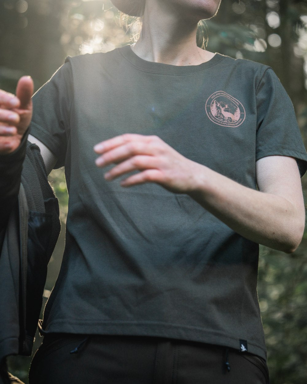 Pine Green Coloured Seeland Womens Hunting Heritage T-Shirt on forest background #colour_pine-green