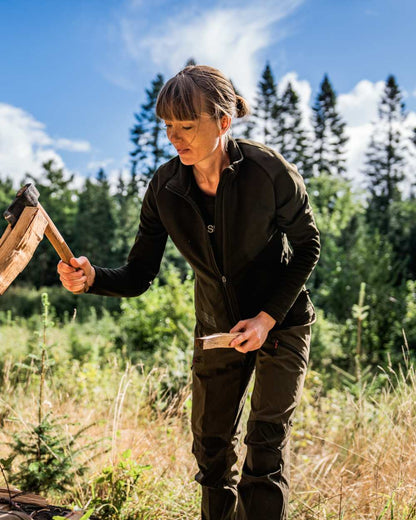 Pine Green Chocolate Torte coloured Seeland Womens Larch Stretch Trousers on forest background #colour_pine-green-chocolate-torte