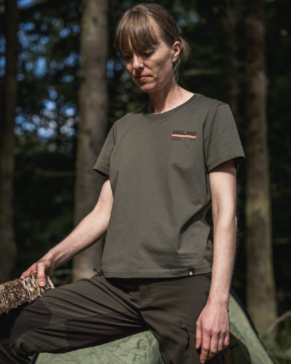 Grape Leaf Coloured Seeland Womens Leala T-Shirt on forest background #colour_grape-leaf