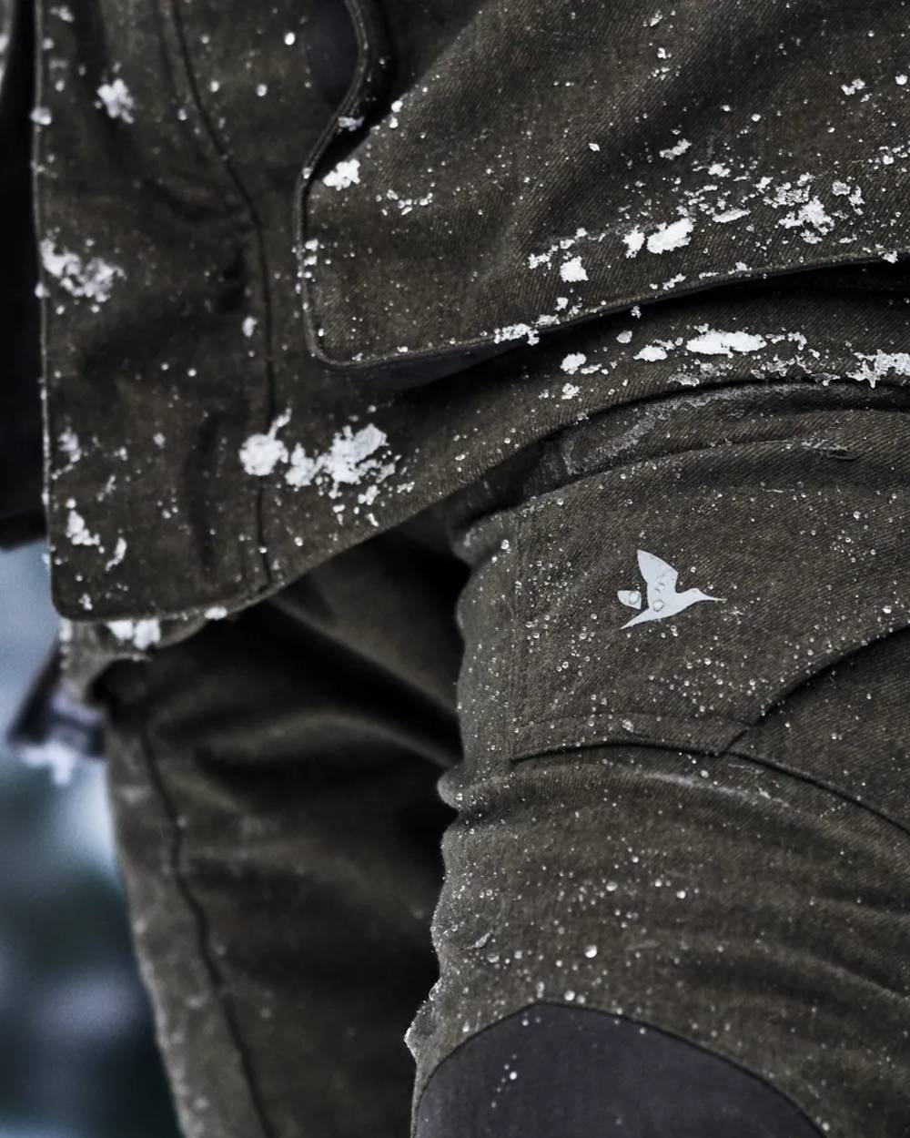 Pine Green Coloured Seeland Womens North Trousers on outdoor background #colour_pine-green