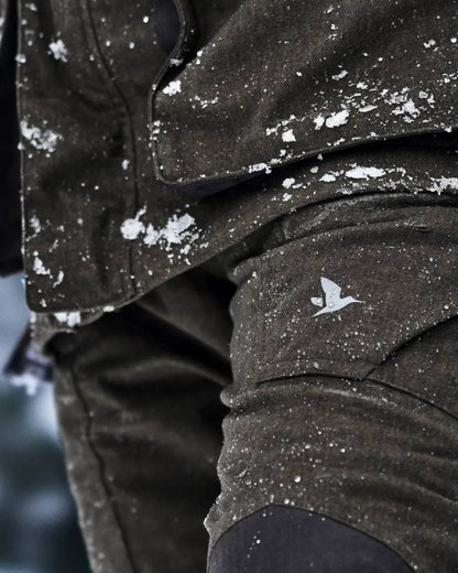 Pine Green Coloured Seeland Womens North Trousers on outdoor background #colour_pine-green