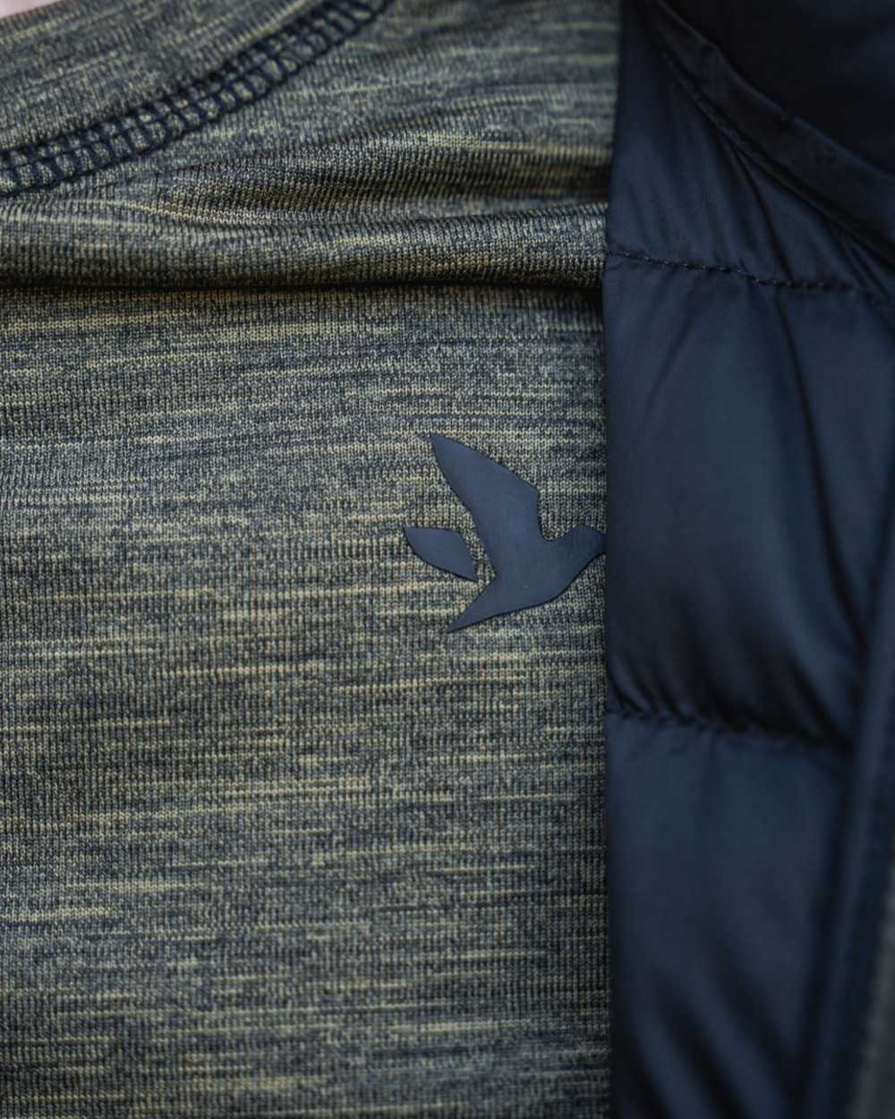 Military Olive Melange coloured Seeland Womens Peak Aia T-Shirt on forest background #colour_military-olive-melange