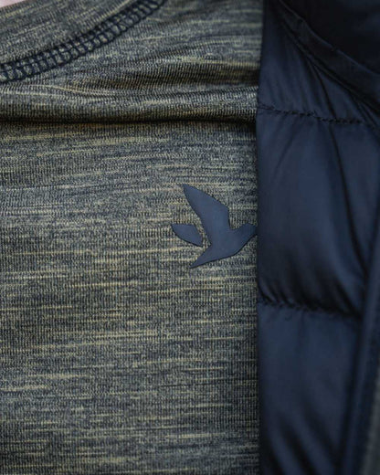 Military Olive Melange coloured Seeland Womens Peak Aia T-Shirt on forest background #colour_military-olive-melange