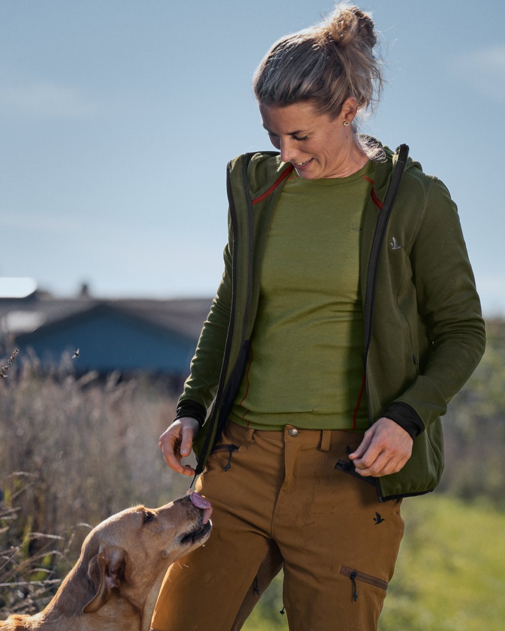 Pine Green Coloured Seeland Womens Power Fleece Jacket on farm background #colour_pine-green