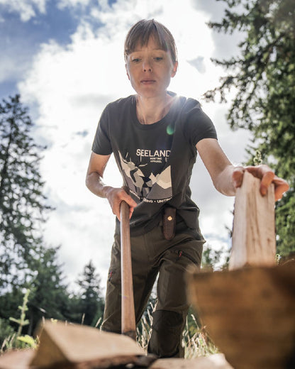 Pine Green Coloured Seeland Womens Sadie T-Shirt on forest background #colour_pine-green