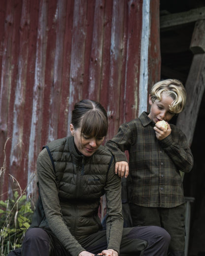 Light Pine Coloured Seeland Womens Therma Waistcoat on forest background #colour_light-pine