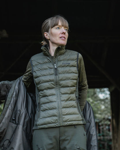 Light Pine Coloured Seeland Womens Therma Waistcoat on forest background #colour_light-pine