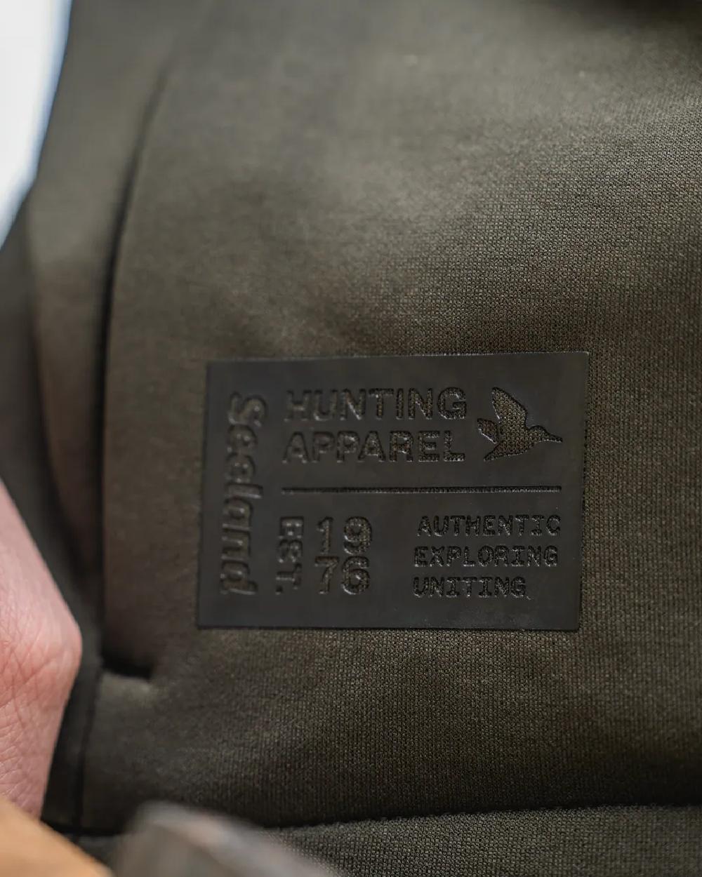 Pine Green Coloured Seeland Womens Tidal Tora Fleece Jacket on outdoor background #colour_pine-green