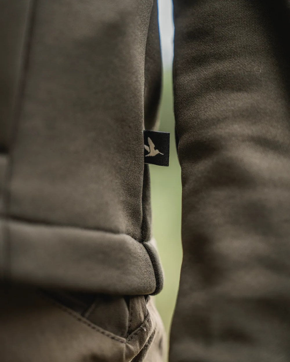 Pine Green Coloured Seeland Womens Tidal Tora Fleece Jacket on outdoor background #colour_pine-green