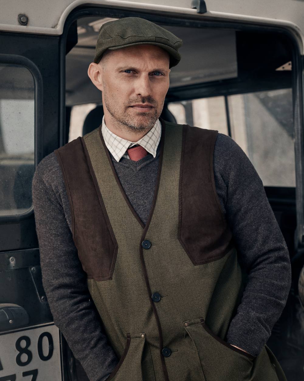 Shaded Olive coloured Seeland Woodcock Advanced Flat Cap on outdoor background #colour_shaded-olive