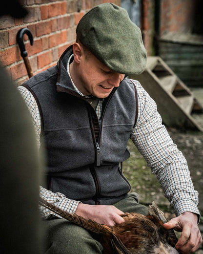Dark Grey Melange coloured Seeland Woodcock Earl Waistcoat on outdoor background #colour_dark-grey-melange