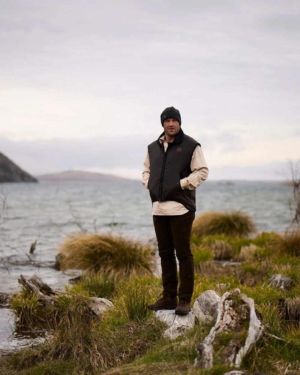 Brown Coloured Swanndri Mens Foxton Oilskin Vest with Wool Lining on sea background #colour_brown