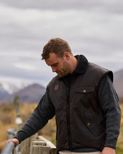 Brown Coloured Swanndri Mens Foxton Oilskin Vest with Wool Lining on sky background #colour_brown
