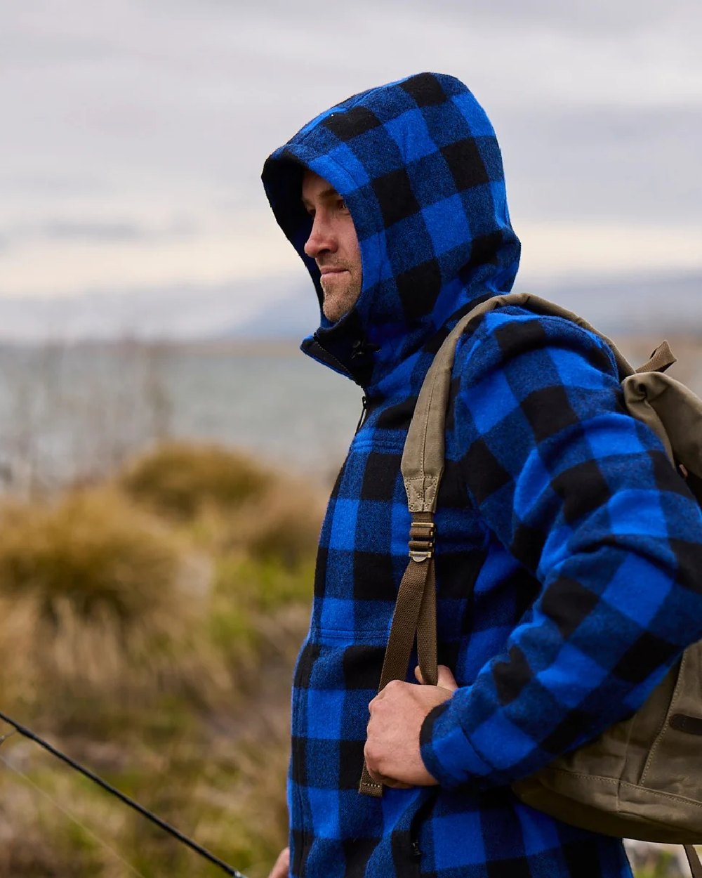 Blue Black Check Coloured Swanndri Mens Hudson Wool Hoodie on sea background #colour_blue-black-check