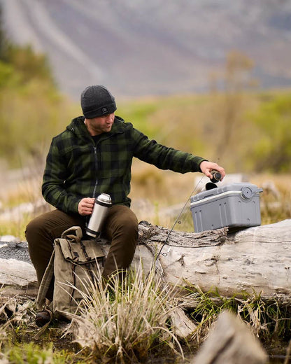 Olive Black Check Coloured Swanndri Mens Hudson Wool Hoodie on forest background #colour_olive-black-check