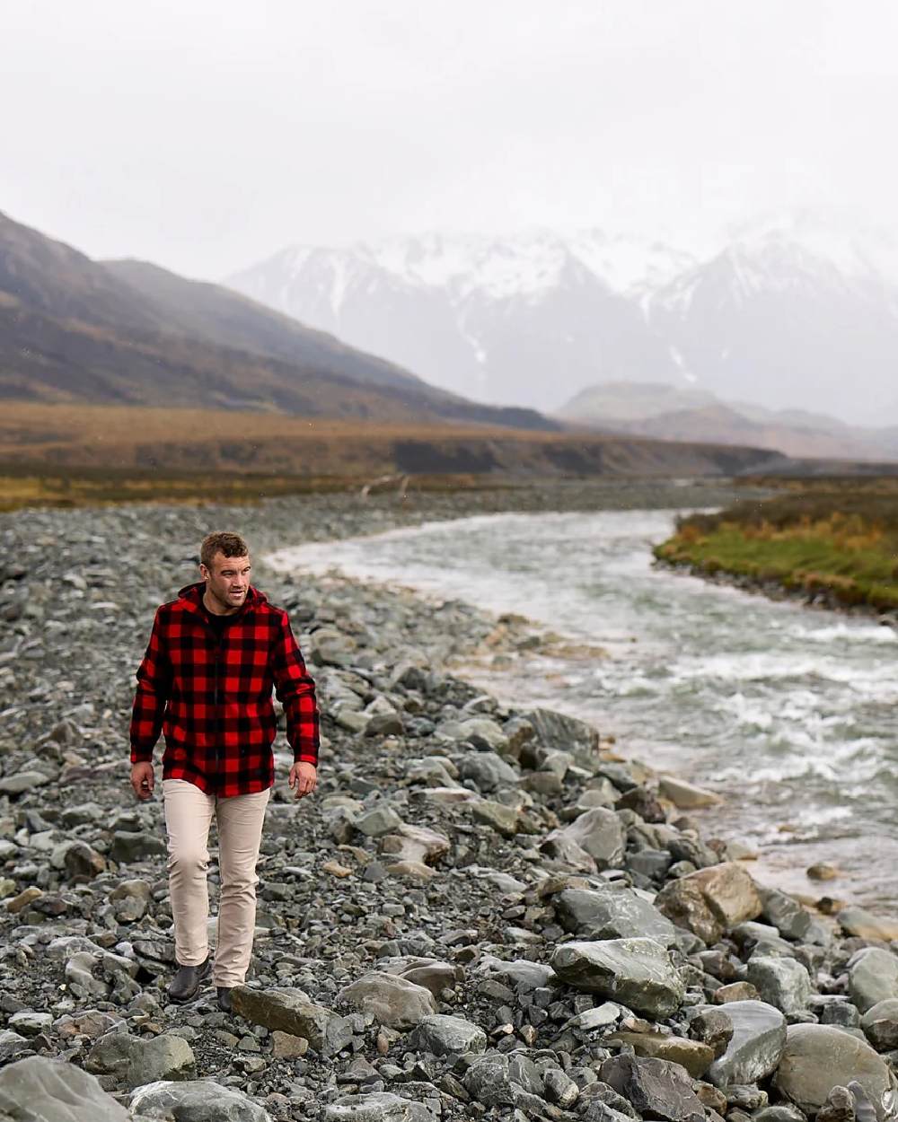 Red Black Check Coloured Swanndri Mens Hudson Wool Hoodie on river background #colour_red-black-check