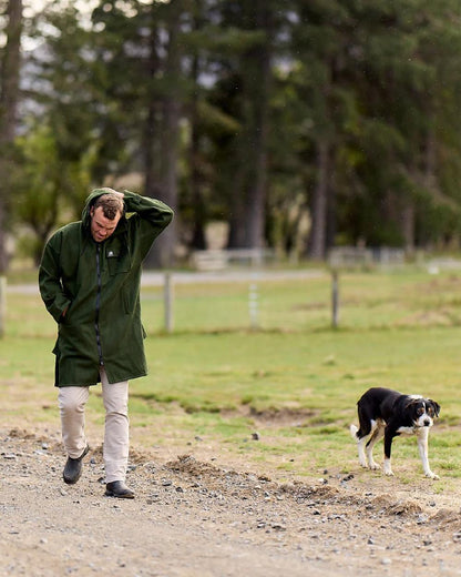 Olive Coloured Swanndri Mens Mosgiel Wool Bushshirt with Zip-up Front on garden background #colour_olive