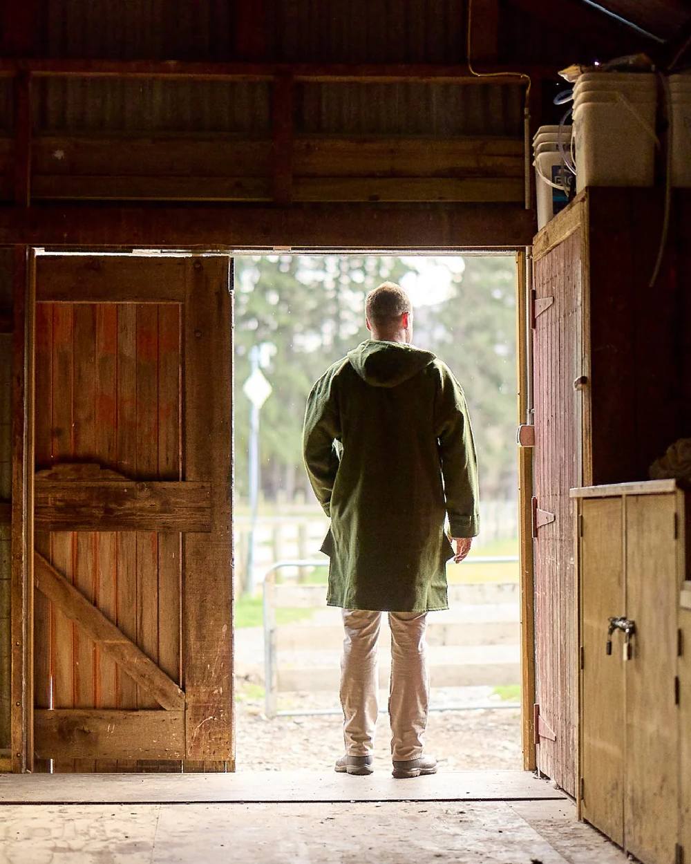 Olive Coloured Swanndri Mens Original Wool Bushshirt With Lace-Up Front on door background #colour_olive