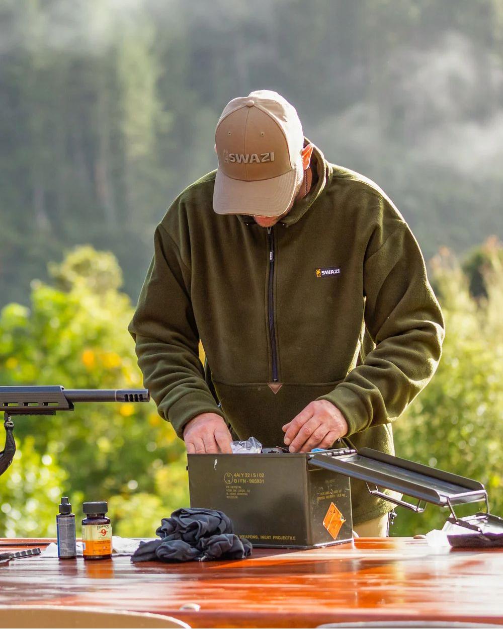 Olive Coloured Swazi Doughroaster on forest background #colour_olive