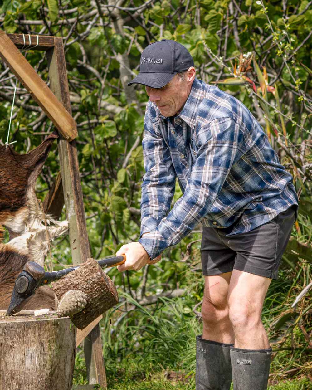 Navy coloured Swazi Grafter Shirt with trees in background #colour_navy