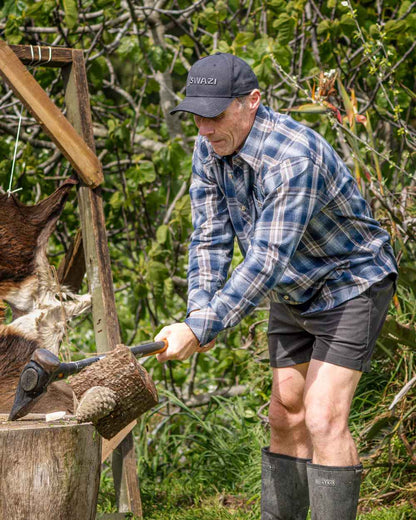 Navy coloured Swazi Grafter Shirt with trees in background #colour_navy