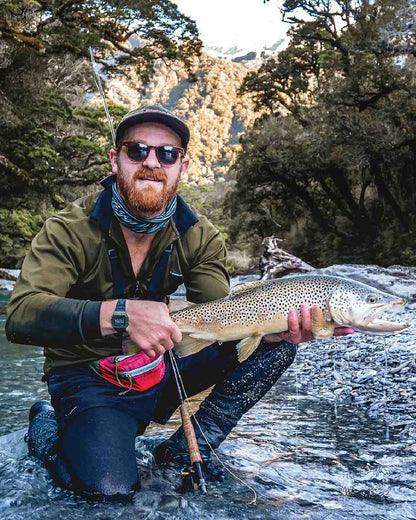 Olive coloured Swazi Mens Climb Max Long Sleeve Polo Shirt on sea background #colour_olive