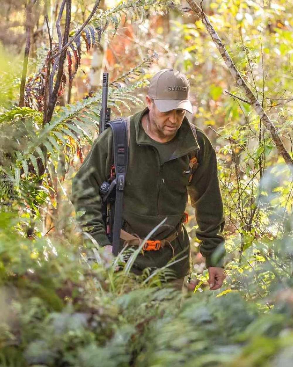 Olive Coloured Swazi Doughroaster on forest background #colour_olive