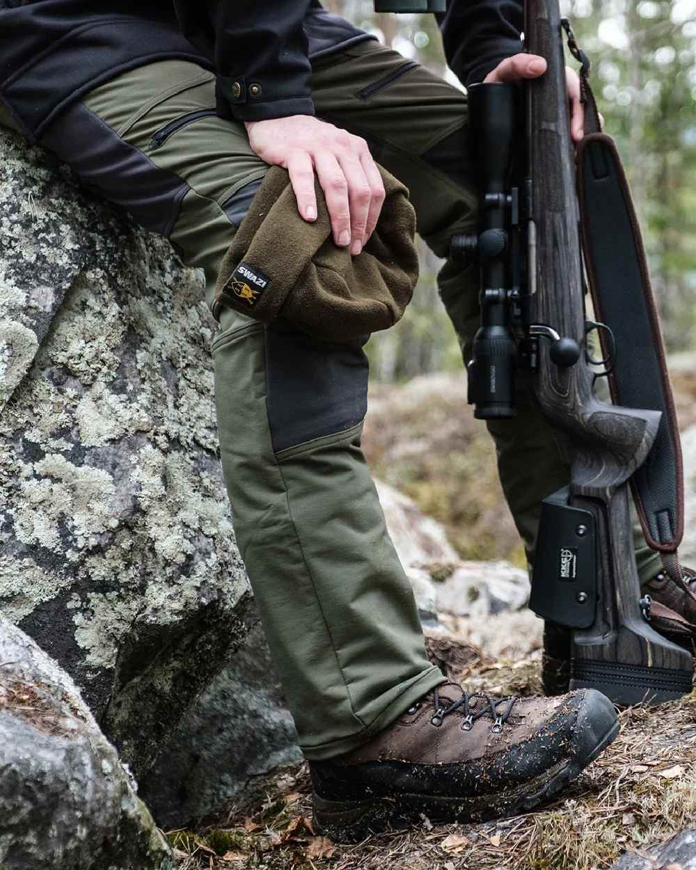 Gran Green coloured Swazi Mens Forest Pants on forest background #colour_gran-green