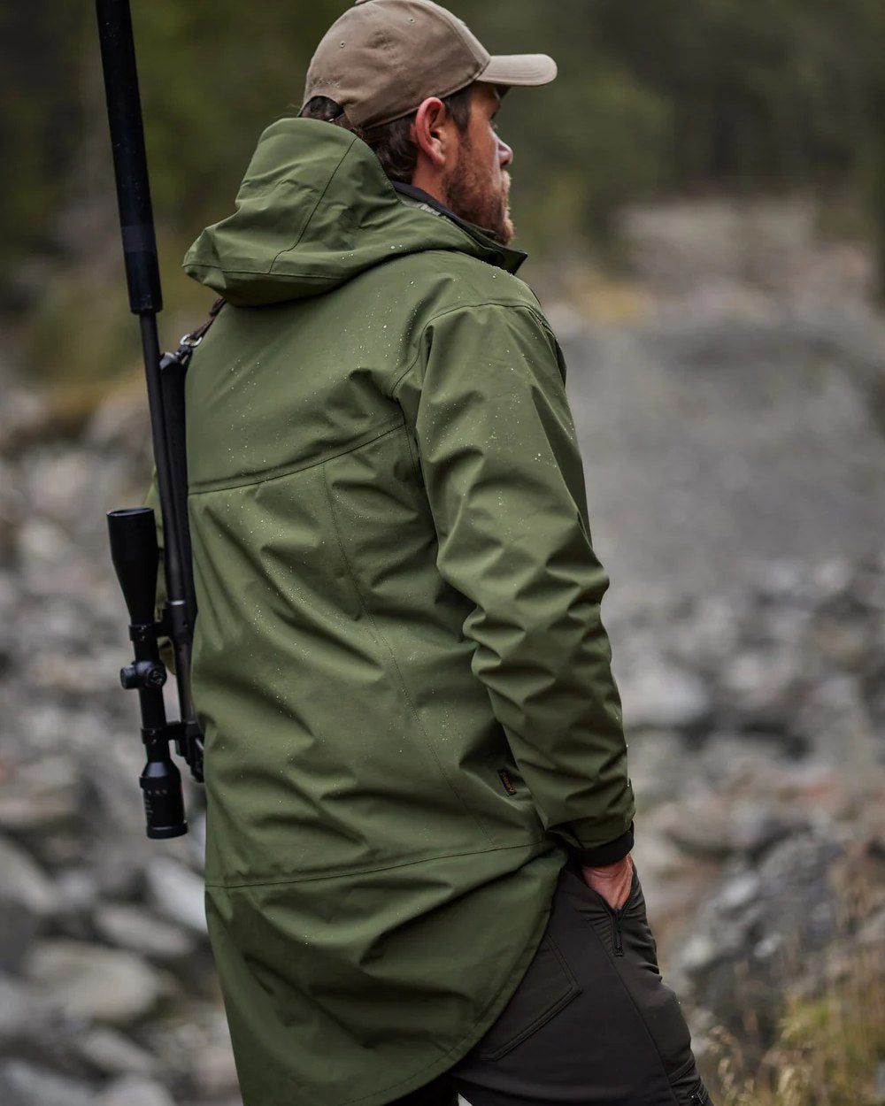 Olive coloured Swazi Mens Sentinel Ultralight Jacket on rock background #colour_olive