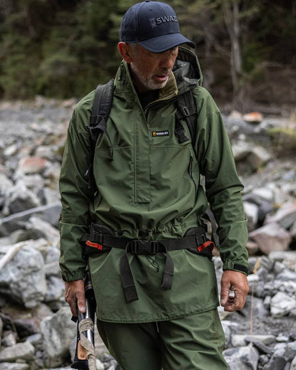 Olive coloured Mens Swazi Mens Tahr Ultralite Jacket on rock background #colour_olive