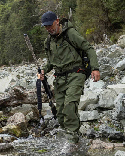 Olive coloured Mens Swazi Mens Tahr Ultralite Jacket on rock background #colour_olive