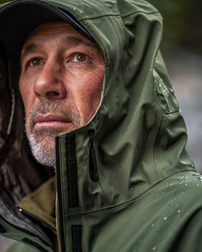 Olive coloured Mens Swazi Mens Tahr Ultralite Jacket on sky background #colour_olive