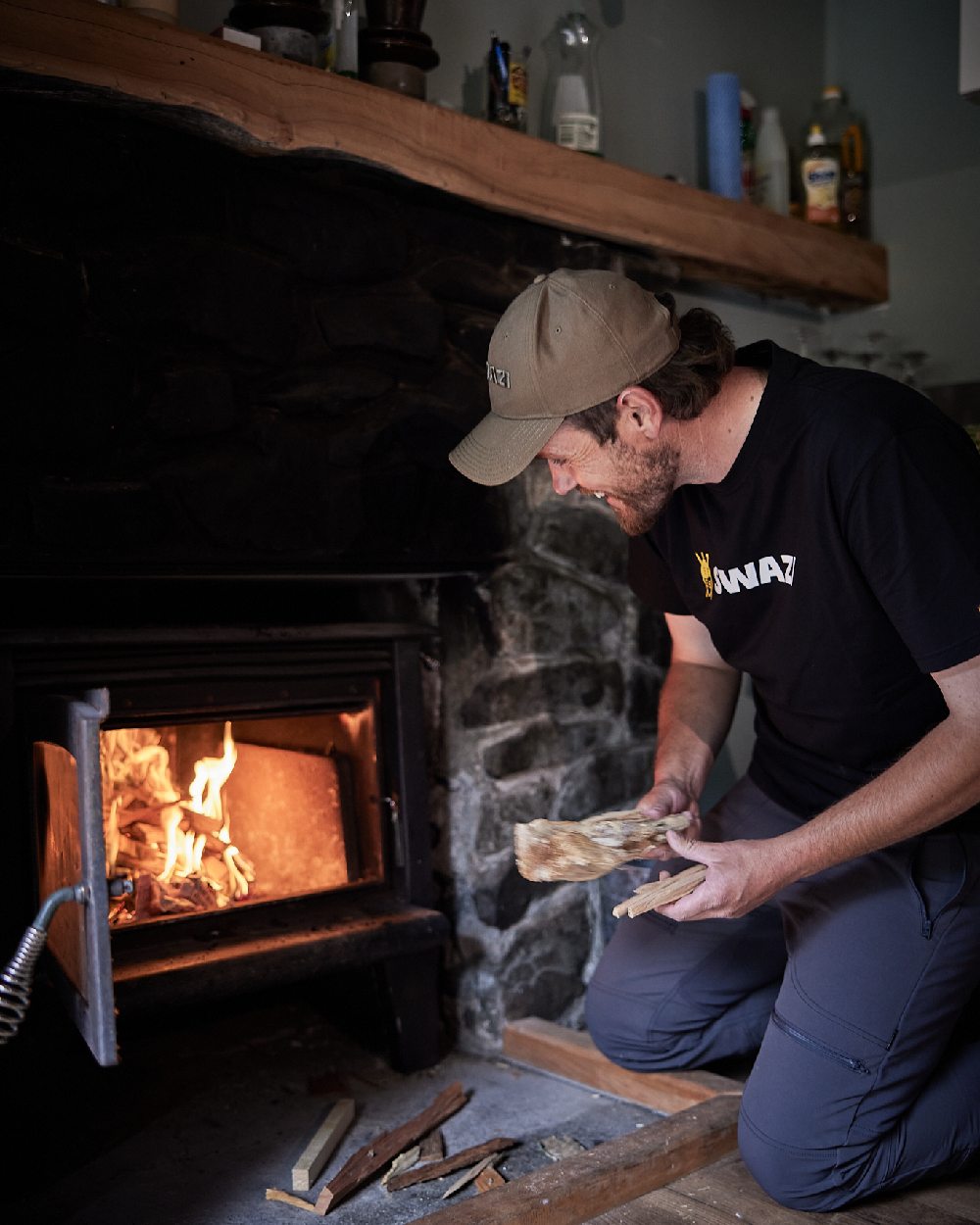 Black Coloured Swazi Tee on room background #colour_black