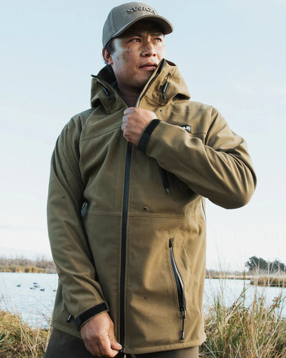 Tussock Green coloured Swazi The Ibex Jacket on sky background #colour_tussock-green