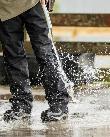 Black Coloured Swazi Torrent Overpants on water background #colour_black